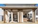 Relaxing covered patio with neutral curtains, ample seating, and an open-air feel at 318 Highland Forest Dr, Fuquay Varina, NC 27526