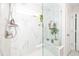 Modern glass shower showcases a built-in bench and marble-style tiling at 318 Highland Forest Dr, Fuquay Varina, NC 27526