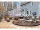 Charming backyard with a gravel patio, a wooden deck and outdoor seating area, perfect for entertaining at 3212 Oxford Dr, Durham, NC 27707