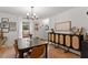 Bright dining room featuring a modern light fixture and stylish decor at 3212 Oxford Dr, Durham, NC 27707