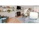 Cozy living room with a decorative fireplace, stylish furnishings, and hardwood flooring at 3212 Oxford Dr, Durham, NC 27707