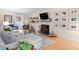 Inviting living room featuring a fireplace, plush seating, and charming decor elements at 3212 Oxford Dr, Durham, NC 27707