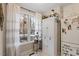Bright sun room featuring natural light and a large window with hanging plants at 3212 Oxford Dr, Durham, NC 27707