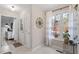 Bright sun room with tile floors, a compass decoration, and large windows with curtains at 3212 Oxford Dr, Durham, NC 27707