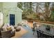 An inviting outdoor deck with stylish furniture and a peaceful backyard view at 3304 Glen Currin Dr, Raleigh, NC 27612