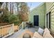 A tranquil backyard deck area with relaxing seating and views of the private yard at 3304 Glen Currin Dr, Raleigh, NC 27612
