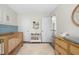 Cozy Bedroom with wood crib, changing table, a colorful bookshelf, and access to the hallway at 3304 Glen Currin Dr, Raleigh, NC 27612