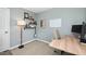 A home office setup with desk, chair, shelving and a hard surface floor at 3304 Glen Currin Dr, Raleigh, NC 27612