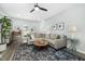Cozy living area with a large sectional sofa, modern lighting, and an inviting atmosphere at 3304 Glen Currin Dr, Raleigh, NC 27612