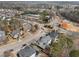 Aerial view of a suburban neighborhood and roundabout with community amenities nearby at 3732 Coach Lantern Ave, Wake Forest, NC 27587