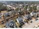 Aerial view of a suburban neighborhood featuring neatly landscaped homes with mature trees at 3732 Coach Lantern Ave, Wake Forest, NC 27587