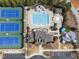 An aerial view shows pool, tennis courts, playground, community center, parking and common areas at 3732 Coach Lantern Ave, Wake Forest, NC 27587