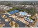 Aerial view of community amenities including tennis courts, pool, community center, and playground at 3732 Coach Lantern Ave, Wake Forest, NC 27587