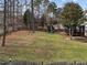 Wide backyard with a playhouse, swing set, and screened porch on the home at 3732 Coach Lantern Ave, Wake Forest, NC 27587