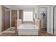 Well-lit bathroom showcasing a tiled shower, separate tub, and window at 3732 Coach Lantern Ave, Wake Forest, NC 27587