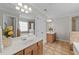 Bathroom featuring a double vanity, tile floors, and a separate tub and shower at 3732 Coach Lantern Ave, Wake Forest, NC 27587
