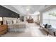 Spacious bedroom featuring a tray ceiling, ceiling fan, accent wall, and ample natural light at 3732 Coach Lantern Ave, Wake Forest, NC 27587
