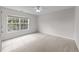 Neutral bedroom with carpet, ceiling fan, large window for natural light at 3732 Coach Lantern Ave, Wake Forest, NC 27587