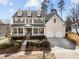 Attractive home with a classic design, featuring a covered porch and a well-manicured front yard at 3732 Coach Lantern Ave, Wake Forest, NC 27587