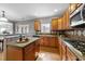 Bright kitchen featuring ample counter space, wood cabinetry, and modern appliances at 3732 Coach Lantern Ave, Wake Forest, NC 27587