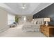Large main bedroom with tray ceiling, decorative wall, and sitting area at 3732 Coach Lantern Ave, Wake Forest, NC 27587