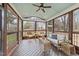 Relaxing screened porch with wood floors, furniture, and views of backyard at 3732 Coach Lantern Ave, Wake Forest, NC 27587