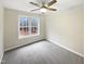 This bedroom has new carpeting, a ceiling fan, and a large window with lots of natural light at 4050 Brooksdale Dr, Franklinton, NC 27525