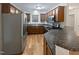 Updated kitchen with stainless steel appliances, wood cabinets, granite countertops and hardwood flooring at 4050 Brooksdale Dr, Franklinton, NC 27525