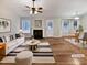 Bright living room featuring hardwood floors, a fireplace, lots of natural light and designer furnishings at 4050 Brooksdale Dr, Franklinton, NC 27525