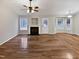 Bright living room featuring hardwood floors, a fireplace, and lots of natural light at 4050 Brooksdale Dr, Franklinton, NC 27525