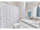 Clean bathroom with a vanity with granite countertops and a tub with shower at 410 Bent Tree Ln, Cary, NC 27519