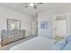 Bright bedroom with an ensuite bathroom featuring a dresser and an art piece at 410 Bent Tree Ln, Cary, NC 27519