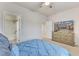 Well-lit bedroom featuring comfortable bed and a view of the bathroom at 410 Bent Tree Ln, Cary, NC 27519