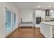 Bright dining area features wood floors and sliding glass doors to outdoor space at 410 Bent Tree Ln, Cary, NC 27519