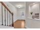 Bright foyer with hardwood floors, elegant staircase, and modern decorative accents at 410 Bent Tree Ln, Cary, NC 27519