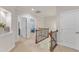 Well-lit upstairs hallway with a view into a bedroom at 410 Bent Tree Ln, Cary, NC 27519