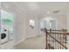 Upstairs hallway with laundry room access and view of the staircase at 410 Bent Tree Ln, Cary, NC 27519