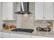 Modern kitchen features granite countertops, stainless steel range hood, and tile backsplash at 410 Bent Tree Ln, Cary, NC 27519