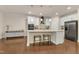 Modern kitchen features stainless steel appliances, granite countertops, a large island with seating at 410 Bent Tree Ln, Cary, NC 27519