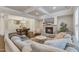 Open living room with stone fireplace, coffered ceilings, and hardwood floors at 410 Bent Tree Ln, Cary, NC 27519