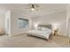 Spacious main bedroom featuring neutral tones, a ceiling fan, and lots of natural light at 410 Bent Tree Ln, Cary, NC 27519