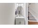 Contemporary powder room with a stylish vanity, oval mirror, and neutral wall color at 410 Bent Tree Ln, Cary, NC 27519