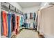 Spacious walk-in closet with ample hanging space and shelving for organized storage at 410 Bent Tree Ln, Cary, NC 27519