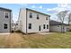 Exterior view of the backyard and rear of a two-story home with a patio at 44 Fairwinds Drive Dr, Lillington, NC 27546