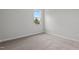 Bedroom featuring large window and carpeted floor at 44 Fairwinds Drive Dr, Lillington, NC 27546