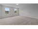 Neutral bedroom featuring two windows, carpet floors, and neutral decor at 44 Fairwinds Drive Dr, Lillington, NC 27546