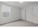 Cozy bedroom featuring soft carpet, a window with blinds, and a closet at 44 Fairwinds Drive Dr, Lillington, NC 27546