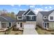 Charming two-story home with a stone facade and well-manicured front yard at 44 Fairwinds Drive Dr, Lillington, NC 27546