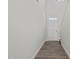 Hallway featuring stylish gray wood flooring and a white door at 44 Fairwinds Drive Dr, Lillington, NC 27546
