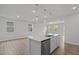 An open-concept space featuring a kitchen island with pendant lighting at 44 Fairwinds Drive Dr, Lillington, NC 27546